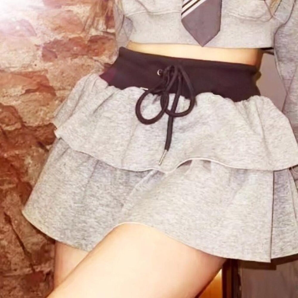 Grey ruffle skirt with black waistband